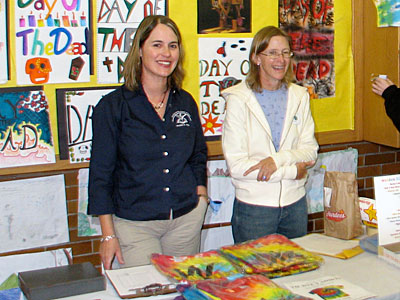 Mindy Flynn and Pam Heitfeld at the PTSA  fundraising table